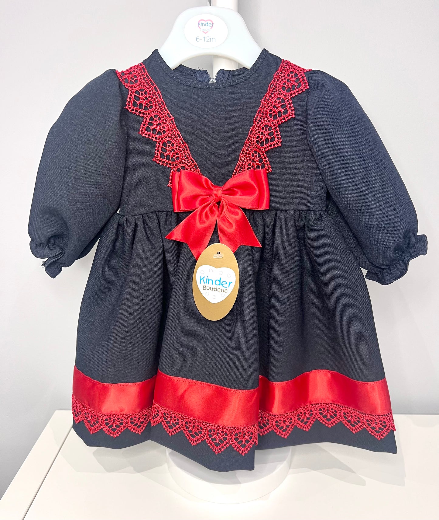 Navy Baby Girl Christmas Kinder Dress with Red Trim and Bow - Perfect for the Holiday Season