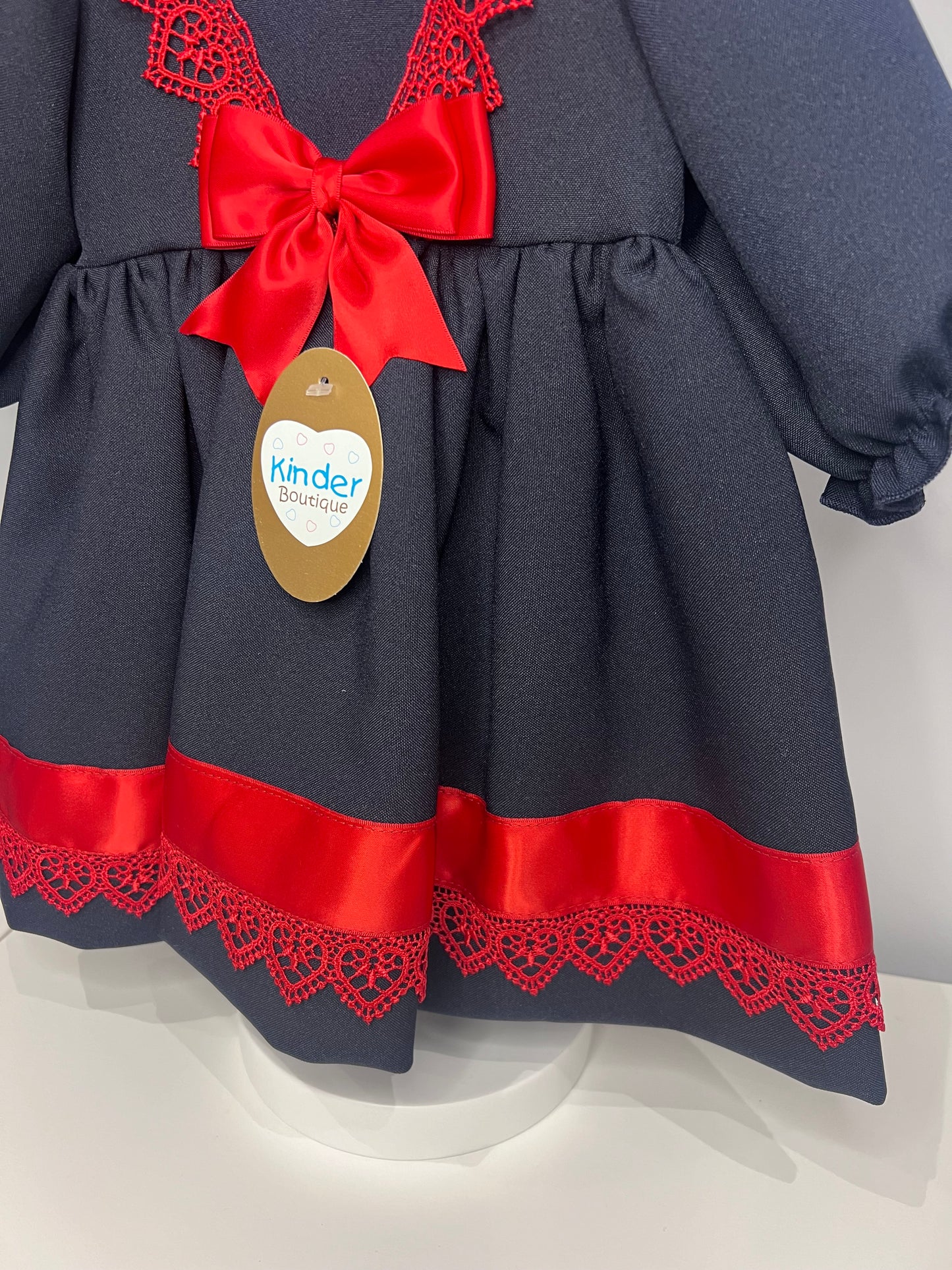 Navy Baby Girl Christmas Kinder Dress with Red Trim and Bow - Perfect for the Holiday Season