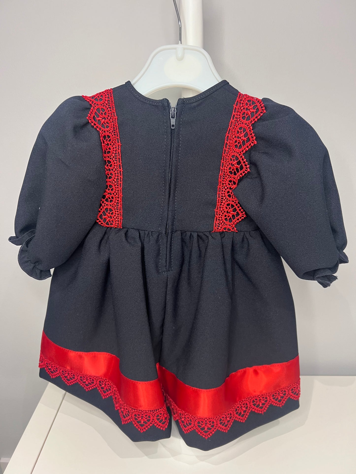 Navy Baby Girl Christmas Kinder Dress with Red Trim and Bow - Perfect for the Holiday Season